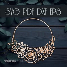 the svg dxf rose wreath is shown on a wooden background with leaves