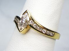 a close up of a ring on a napkin holder with a diamond in the middle