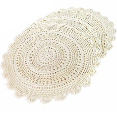 crocheted doily is shown in white on a white background with an oval design