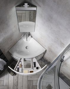 an aerial view of a bathroom sink and mirror