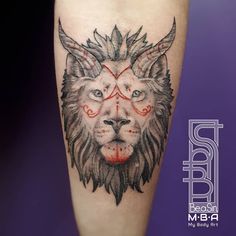 a lion tattoo on the leg with red eyes