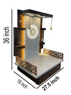 a white and black display case with lights on the front, and an intricate design on the back