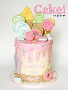 there is a cake decorated with ice cream and donuts