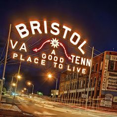 the sign for bristol va is lit up at night