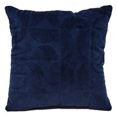 a dark blue pillow with circles on the front and back, sitting on a white surface