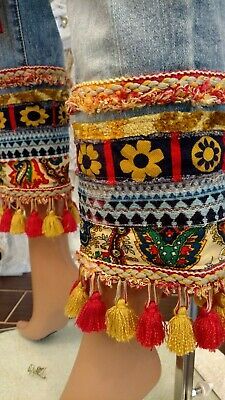 the legs are decorated with colorful beads and tassels