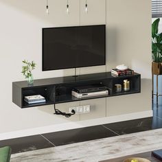 a flat screen tv mounted to the side of a wall