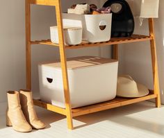 a wooden shelf with baskets and shoes on it