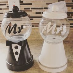 two wedding candy dispensers with mr and mrs written on the top one