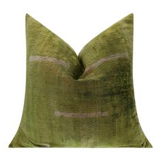 a green pillow with pink stripes on it