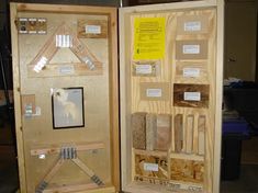 two wooden boxes with different types of wood in them and labels on the doors that are labeled