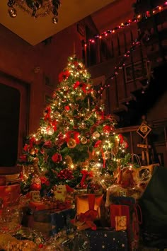 a christmas tree with presents under it