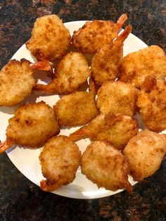 some fried food on a white plate on a table