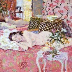 a painting of a woman laying on a bed next to a table with flowers in it