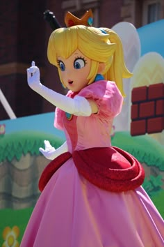 a cartoon character dressed up in a pink dress and holding a wand with her right hand