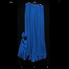 Moroccan Cotton Rayon Blend Blue Flowy Skirted Bottoms, Blue Flowy Bottoms, Casual Flowy Blue Skirt, Chic Flowy Blue Skirt, Chic Flowy Blue Bottoms, Elegant Blue Stretch Maxi Skirt, Flowy Blue Maxi Skirt With Lining, Flowy Long Blue Skirt, Blue Stretch Maxi Skirt For Spring