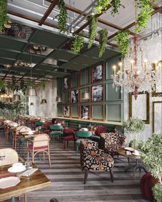 the interior of a restaurant with many tables and chairs, plants hanging from the ceiling