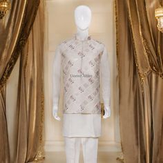 The cream waistcoat is a luxurious piece of clothing made from embroidered fabric with intricate embellishments. Its elegant design makes it perfect for special occasions. The accompanying kurta and pajama are both white and complement the waistcoat beautifully. Here are some key features of the outfit: Luxurious fabric: The waistcoat is made from high-quality embroidered fabric,giving it a rich and luxurious feel.Intricate embellishments: The waistcoat is adorned with delicate embellishments adding to its elegance and sophistication.Elegant design:The overall design of the outfit is classic and timeless, making it suitable for various formal events.Perfect for special occasions: This outfit is ideal for weddings, receptions, and other special celebrations.Comfortable and breathable: The k Luxury Classic White Kurta, Prince Coat Shalwar Kameez, Designer Mehndi, Raw Silk Kurta, Black Tuxedo Suit, Waistcoat Designs, Prince Coat, Golden Embroidery, Sherwani Groom