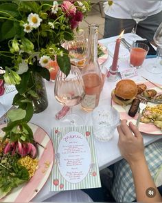 a table is set with food and drinks for a celebration or brunch party