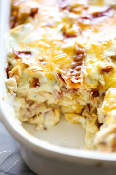 a casserole dish with bacon and cheese on it