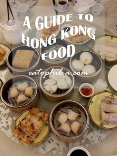 a guide to hong kong food on a table with plates and bowls full of food