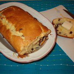 a loaf of bread sitting on top of a white plate