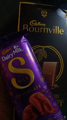 dairy milk chocolate bar next to box of rounvillee