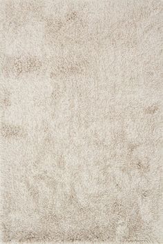 a white area rug with very soft shag on the top and bottom part of it