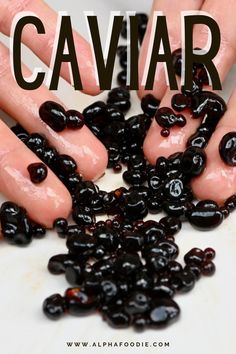 hands reaching for black olives with the words caviar above them and below it