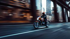 a person riding a motorcycle on a city street at night with tall buildings in the background