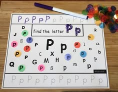 a paper with letters and numbers on it next to a pencil, some confetti and a crayon marker