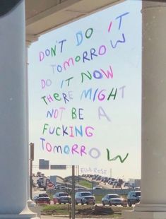 a sign on the side of a building that says don't do it tomorrow