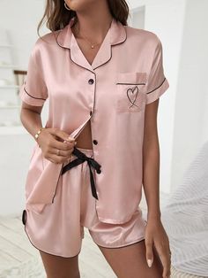 Elevate your loungewear with our Embroidery Contrast Binding Satin Set. Effortlessly combining comfort and style, this casual-comfy ensemble features a playful geometric pattern and delightful bow detail. The button-front top and pocketed shorts exude relaxed charm. With a loose fit and slight stretch, it's suitable for family gatherings and cozy days. Crafted from premium satin, it's easy to care for with a machine wash or professional dry clean. Redefine relaxation with this luxurious 2-piece Silk Pajamas Shorts, Silk Pajamas Women, Pyjama Satin, Heart Embroidery, Spring Shorts, Elastic Shorts, Satin Short, Satin Pyjama Set, Satin Pajamas