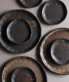 four dirty plates sitting on top of a white counter