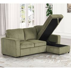 a green couch with an open storage compartment