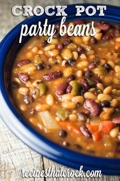 crock pot party beans in a blue bowl on a wooden table with text overlay