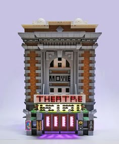 a lego movie theater set is shown in front of a purple background with the words theatre on it