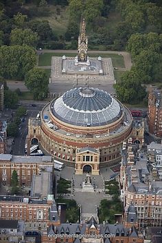 an aerial view of a large building in the city