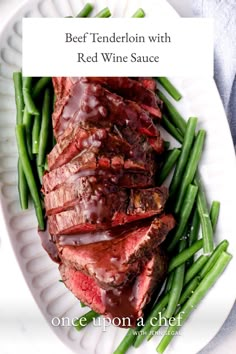 beef tenderion with red wine sauce served on green beans