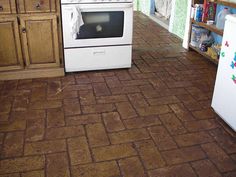 a white stove top oven sitting inside of a kitchen