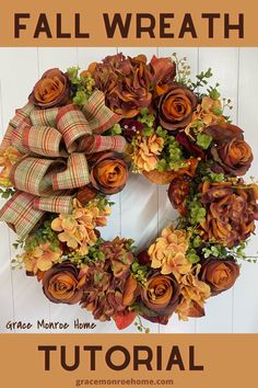 a fall wreath with flowers and leaves on it