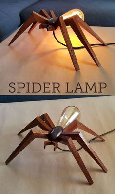 a spider lamp sitting on top of a table next to a sign that says spider lamp