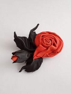 Leather rose. Leather flower brooch or hair clip decoration for dresses, suits, jackets, purses, coats and hats. * Leather: genuine * Color: orange (flowers), green (leafs) * Weight: ~20 g * Package: gift box. * Occasion: all occasions * Care: flower is not waterproof, can not be washed, dry cleaned or ironed (just handle with love and care) Leather Rose, Rose Brooch, Leather Flower, Pin Hair, Flowers Green, Leather Flowers, Orange Leather, Orange Flowers, Flower Brooch