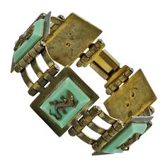 Fabulous Jean Painlevé French Art Deco gold plated link bracelet, with mint green Bakelite, and featuring five salamanders. Measuring length 17.7cm / 6.9 inches by width 2.4cm / .9 inch. The bracelet has wear to the gold plating and scratching. The salamanders are in good condition, one has a twisted tail. This is a beautiful Painlevé salamander bracelet from the Art Deco era. Circa 1930s. A rare find. Measuring Length, Art Deco Gold, Salamanders, Liquid Silver, French Art Deco, Art Deco Era, French Art, Link Bracelets, Arm Band