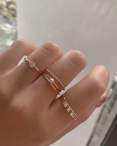 Simple stacker ring with a lot of sparkles! Made in 14k gold fill and is tarnish-resistant, showerproof, and safe for sensitive skin. Just keep it away from chemicals such as hand sanitizer, soap, and lotion for a longer life span. …………………………………. D E T A I L S • Available from US 5 to 10• Band measures 1mm• Keep away from chemicals such as lotion, soap, and hand sanitizer• Tarnish-resistant, waterproof, and safe for sensitive skin • 100% 14K Gold Filled • Build your ring stack and save up to 15% Cute Rings Aesthetic Simple, Minimalist Rings Stacking, Mum Diy, Simple Gold Jewelry, Pearl Stacking Ring, Dainty Gold Jewelry, Hand Rings, Stacker Rings, Gold Rings Simple