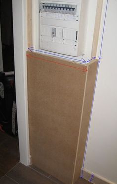 an electrical panel is taped to the wall