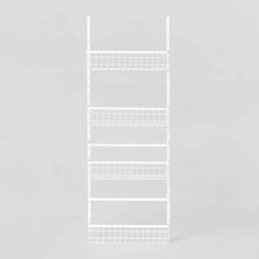 white wire shelving unit with four shelves on each side and one shelf above the other