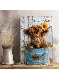 a painting of a cow with a sunflower on it's head in a blue bucket