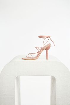 The Soleil Heel, the naked shoe. Back in a beautiful blush tone, features a lace up front with a bamboo effect high heel. This heel is open toe with delicate ties that can be tied around the ankle or to mid-calf. Blush Tones, Box Clutch, Happy Hour, Leather Heels, Mid Calf