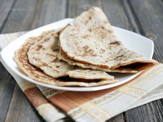 some tortillas are on a white plate